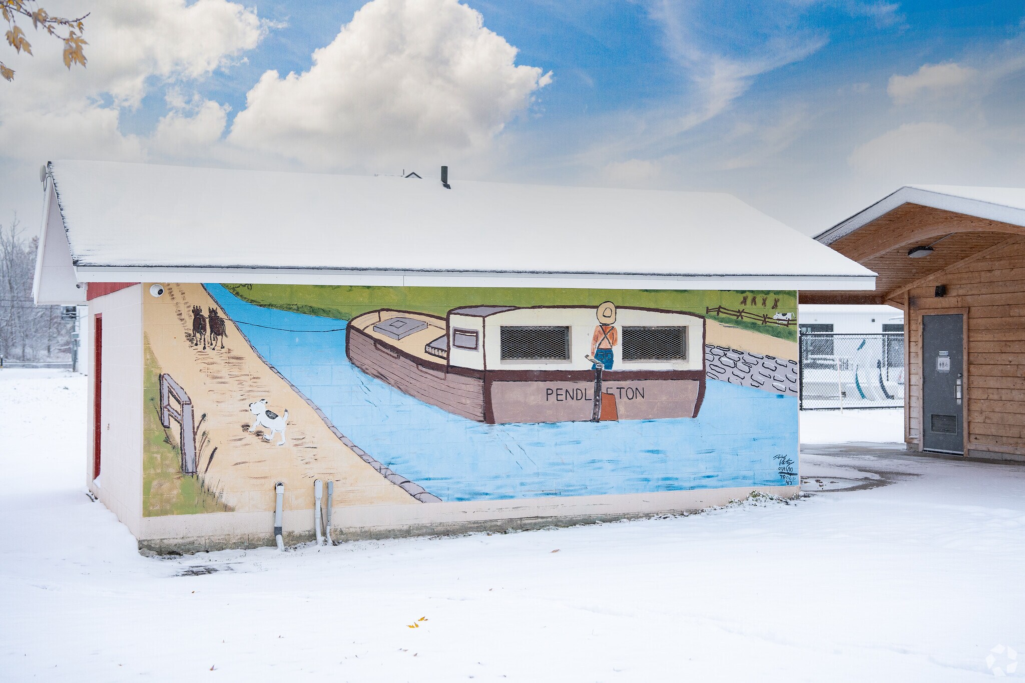 Pendleton, New York mural on a snow-covered building