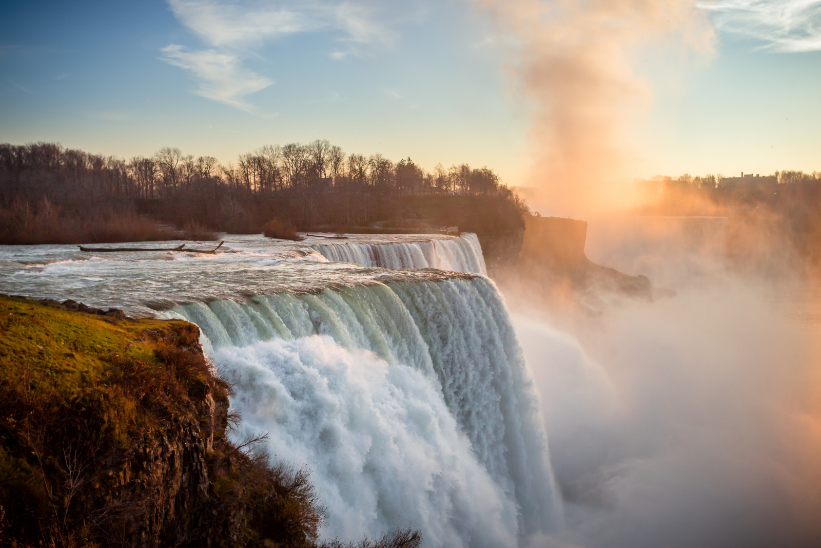 Niagara Falls surrounded by mist at sunrise